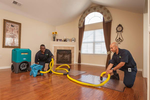 ServiceMaster by CME techs restoring water damage in a Pasa Robles home